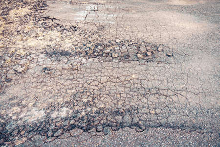 vintage tone image of damaged crack street day time.の写真素材