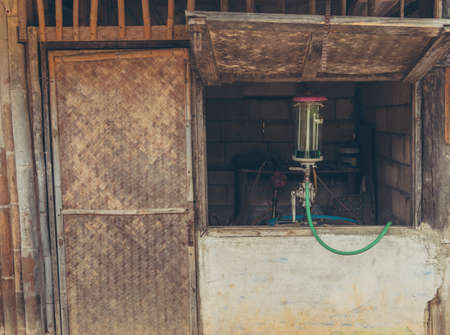 vintage tone image of Gas pump nozzles in the retro service station.の写真素材