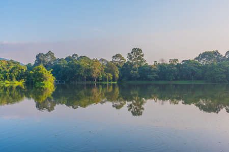 image of lake and the mountain with beautiful blue sky in evening time at ang kaew in Chiang Mai University ,Thailand.の写真素材