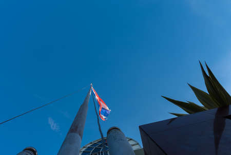 Flag of Thailand with clear blue sky for background.の写真素材