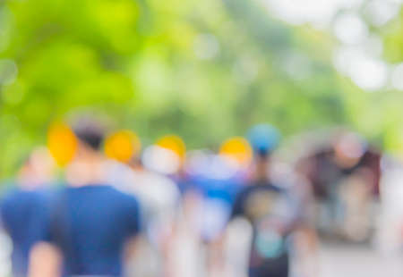 image of blur people walking on street with sunny day in green forest for background usage .の写真素材