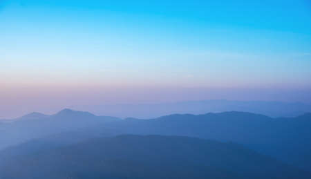 image of row of mountain on morning time to see mist covered on hight peak line.の写真素材