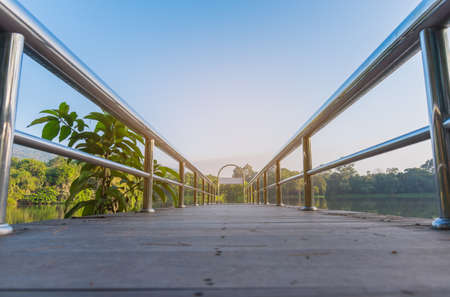 stainless steel bridge or pier at ang kaew lake in Chiang Mai University ,Thailand.の写真素材