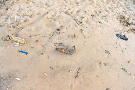 Many types of garbage are placed on the beach.