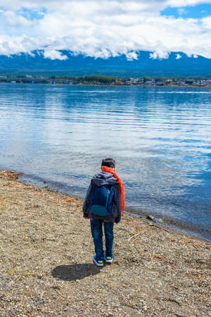 Image of young japanese boy walking in Kogamasao Memorial public Park near kawaguchiko lake Japan.の写真素材