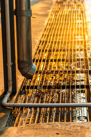 Image of Roof gutter pipeline after rain with water drainage.