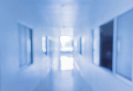 Vintage tone image of blur empty long corridor at hospital