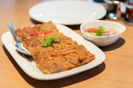 Thai style Fried Bread with Minced Pork Spread in white dish.の写真素材