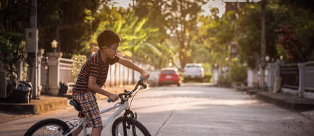 Asian boys practice cycling alone.の写真素材