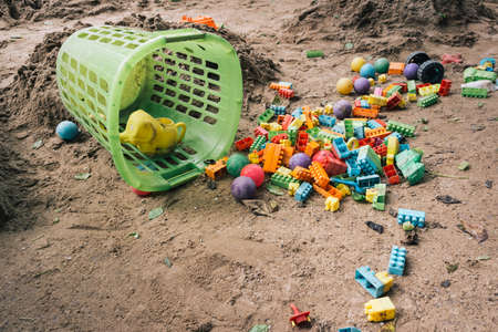 vintage tone of Empty sand yard, toys, jigsaw puzzle The ball, but without children, was abandoned like a lost person.の写真素材