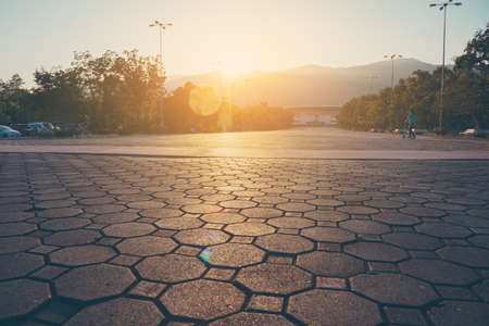 vintage tone image of road to grand stadium soccer field on sunset timeの写真素材