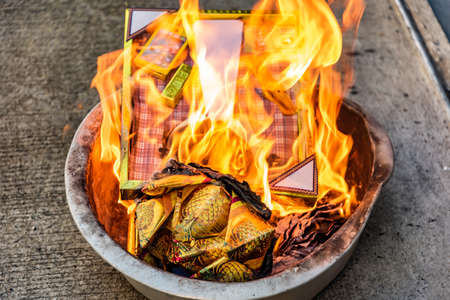Burning fake gold in the Chinese New Year's Day event It is the belief that those money can be sent...