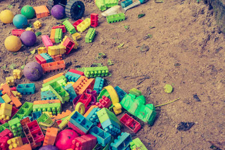 vintage tone of Empty sand yard, toys, jigsaw puzzle The ball, but without children, was abandoned like a lost person.の写真素材