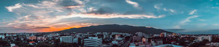 vintage tone image of cloudy blue sky on mountain and Chiang Mai city for background usageの写真素材