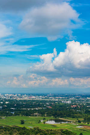 vertical image of Chiang Mai province,Thailand the old city on day with mist covered building view from high angle spot.の写真素材
