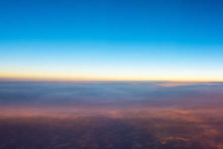 View from airplane window to see sky and horizon on evening timeの写真素材