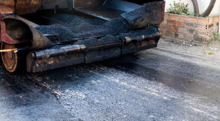 image of car and asphalt road fixing on day time.の写真素材