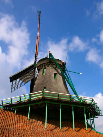 Picture of dutch windmill with nice green grass in front of them