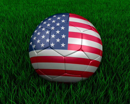 American soccer ball in grass.の写真素材