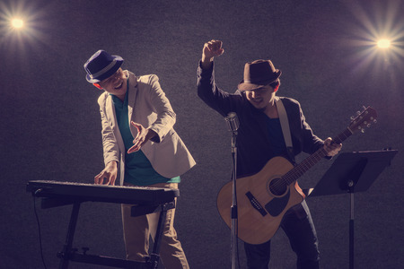 duo musician in darkの写真素材