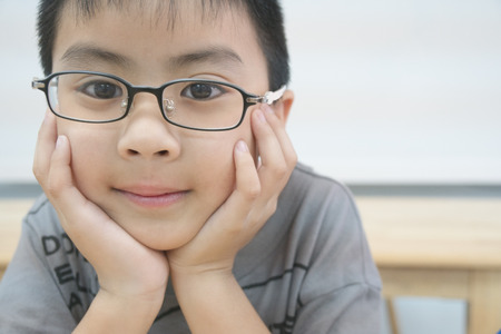 Asian child wearing glassesの写真素材