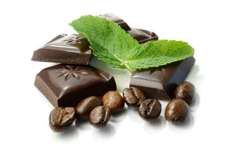 Studio macro of chocolate, fresh mint leaves and coffee beans. Copy space.の写真素材