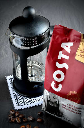 NOTTINGHAM, UK - MAY 2, 2014: Costa Coffee filter coffee foil pack with fresh coffee beans and cafetiere. Costa Coffee is a British coffeehouse company founded in 1971 by Italian brothers Sergio and Bruno Costa.のeditorial素材