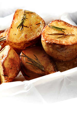 Roast potatoes with rosemary herbs and rock salt. Copy space.の写真素材