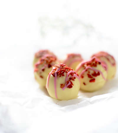 Strawberry and Champagne Truffles against a light background. Copy space.