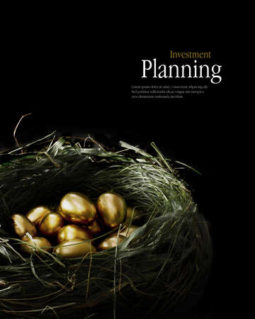 Creatively lit golden eggs in a genuine bird nest representing savings and investments.の写真素材