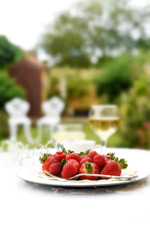 Fresh summer fruits with selective focus against a garden setting. Generous accommodation for copy space.の写真素材