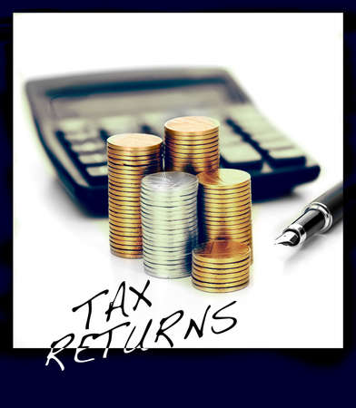 Concept image for tax domestic and business returns. Visual reminder image for fridge magnet or kitchen pin board.の写真素材