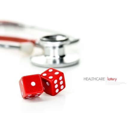 Two red dice and stethoscope close-up against a light background with copy space. Concept image for...