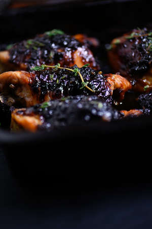 Close up image of caramelized chicken fillets with thyme herbs. Conceptual image for cooking, bbq and food preparation. Generous accommodation for copy space.の写真素材
