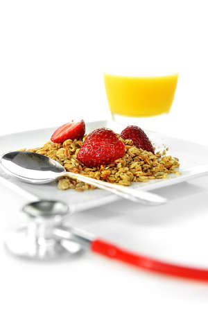 Concept image for healthy eating. Wholegrain granola with sliced strawberries with a deliberate...