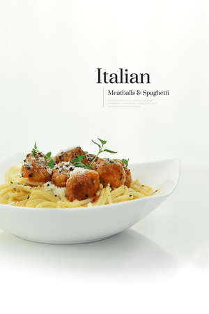 Authentic Italian meatballs in tomato sauce poured over spaghetti with olive oil and thyme garnish, shot against white, with accommodation for copy space.の写真素材