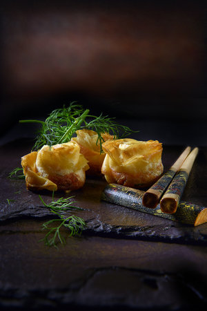 Traditional styled Chinese prawn roses with chilli and crispy filo pastry. Shot against a dark...