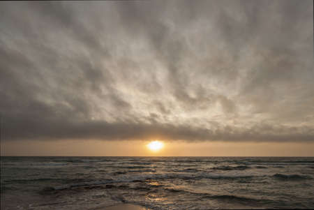 Beach at sunset with clouds in Salento - Italyの写真素材