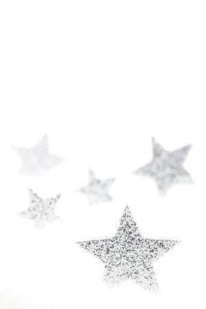 silver chrismas stars isolated on white with copy spaceの写真素材