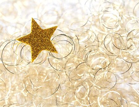 christmas star in front of golden background の写真素材