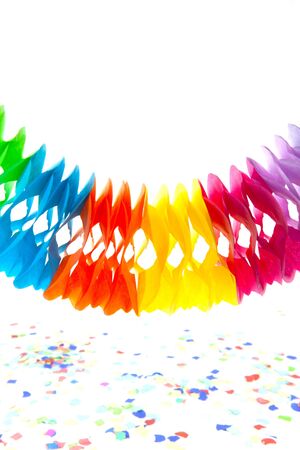 garland and confetti on table isolated on white with copy spaceの写真素材
