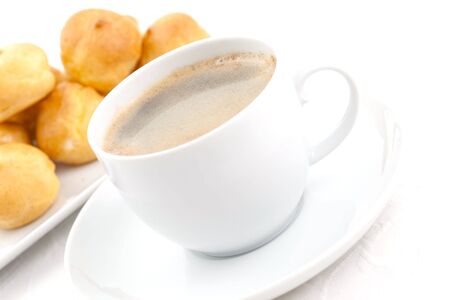 coffee and cream puff on tableの写真素材