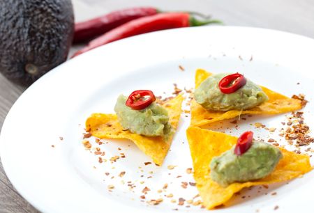 tapas with guacamole on plate の写真素材