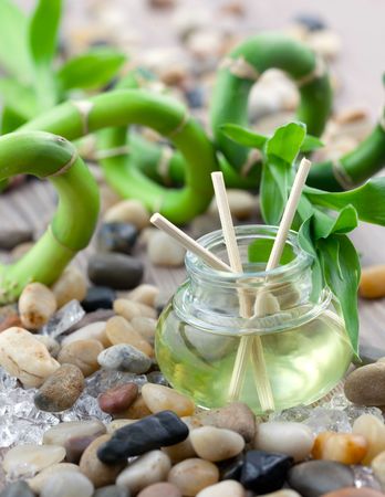 wellness oil with bamboo in backgroundの写真素材