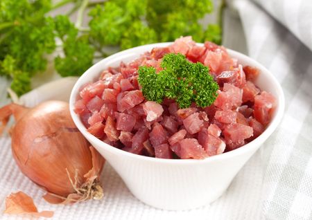 fresh ham diced in a bowl の写真素材