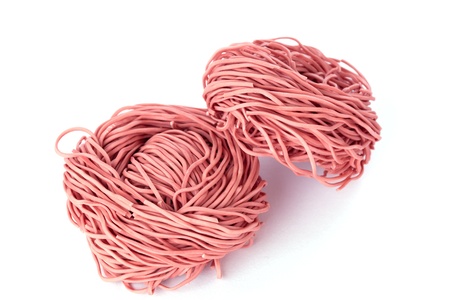 red pasta isolated on white background の写真素材