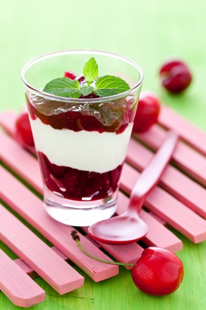 fresh cherry dessert in a glass with yogurt の写真素材