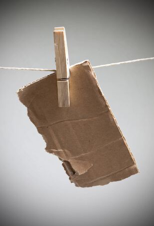 a piece of cardboard on cord with copy space  の写真素材