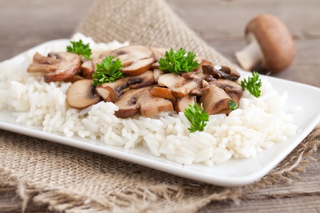 cooked rice with mushrooms and parsley の写真素材