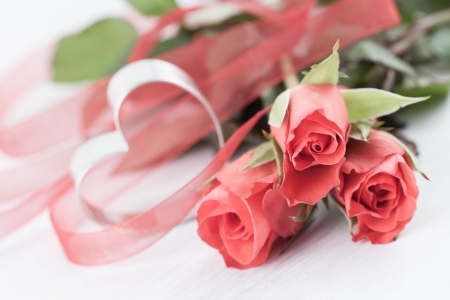 three roses and heart shape の写真素材